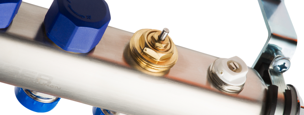 Коллектор из нержавеющей стали 1" для систем напольного или радиаторного отопления со встроенными запорно-регулирующими и термостатическими вентилями.